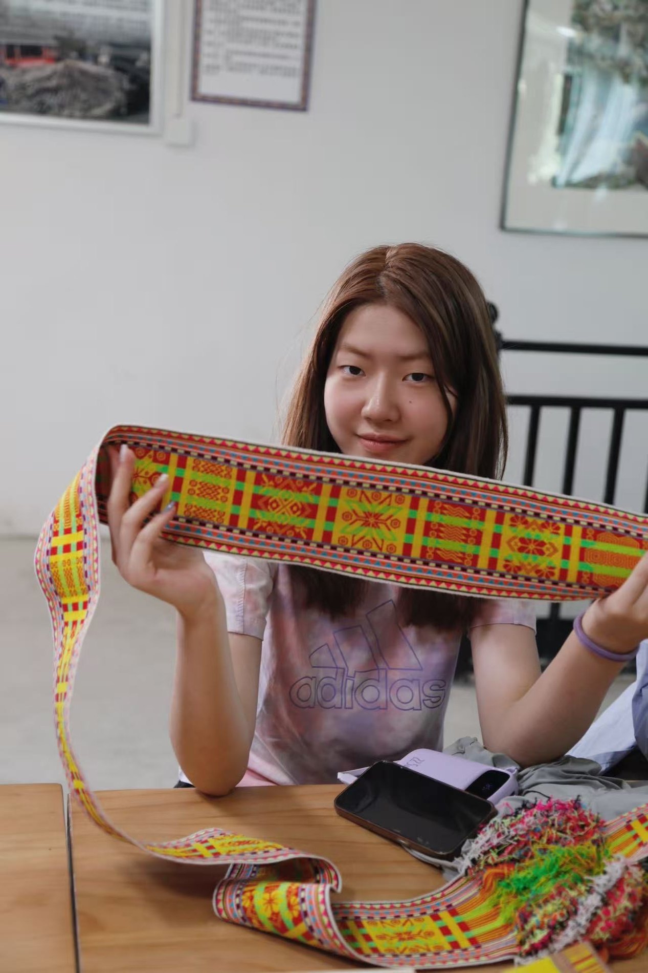 A person holding a colourful object