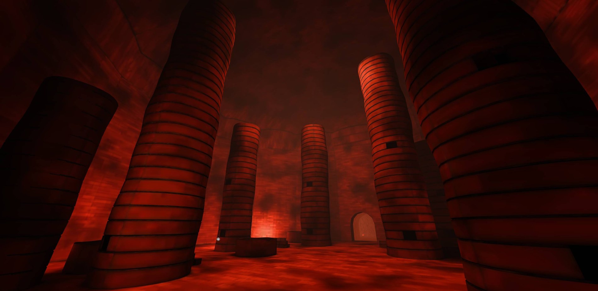 Vertical stacks of kiln furniture inside a red-lit chamber